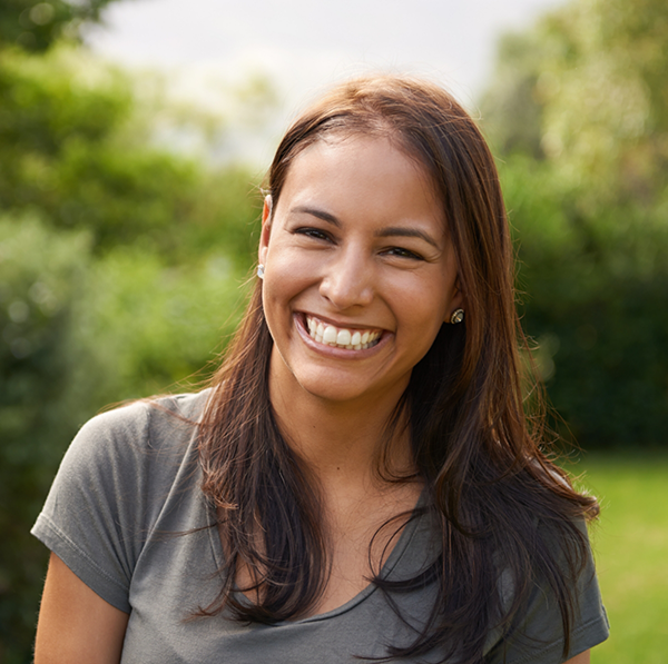 Woman standing outside smiling