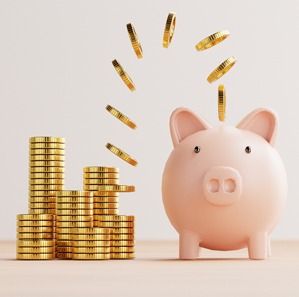 Stacks of coins sitting next to piggy bank